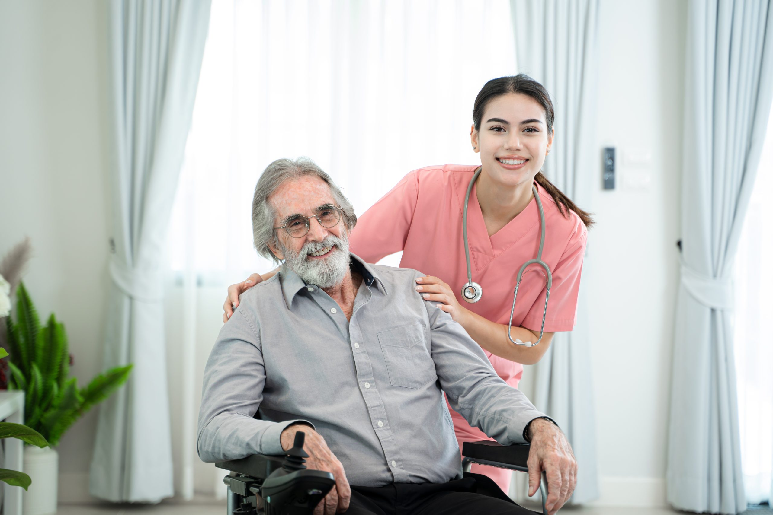 Professional caregiver providing compassionate care to senior resident