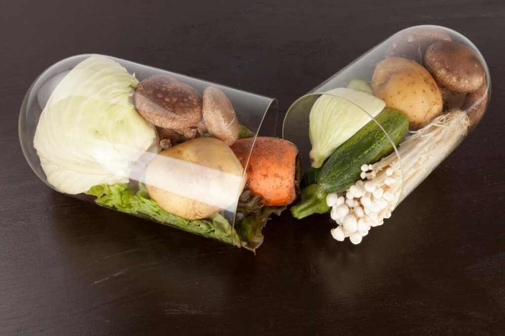 Healthy vegetables arranged inside a capsule symbolizing nutrition supplements, representing how dietary needs change after age 70 for seniors.