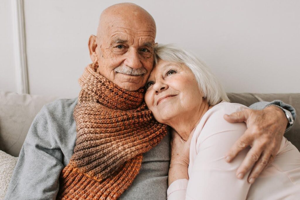 An elderly couple embracing with warmth and love, representing how Ace Home Care supports aging couples with compassionate in-home care services.