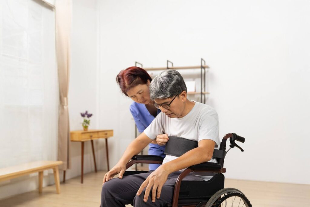 Caregiver assisting an elderly person in a wheelchair at home, highlighting how Ace Home Care helps seniors stay Safe and supported at home in Evanston.