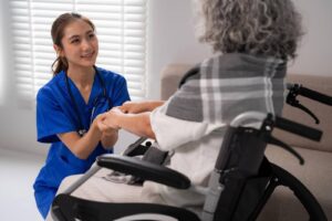 Caregiver providing compassionate home care services to a senior in a wheelchair by Ace Home Care
