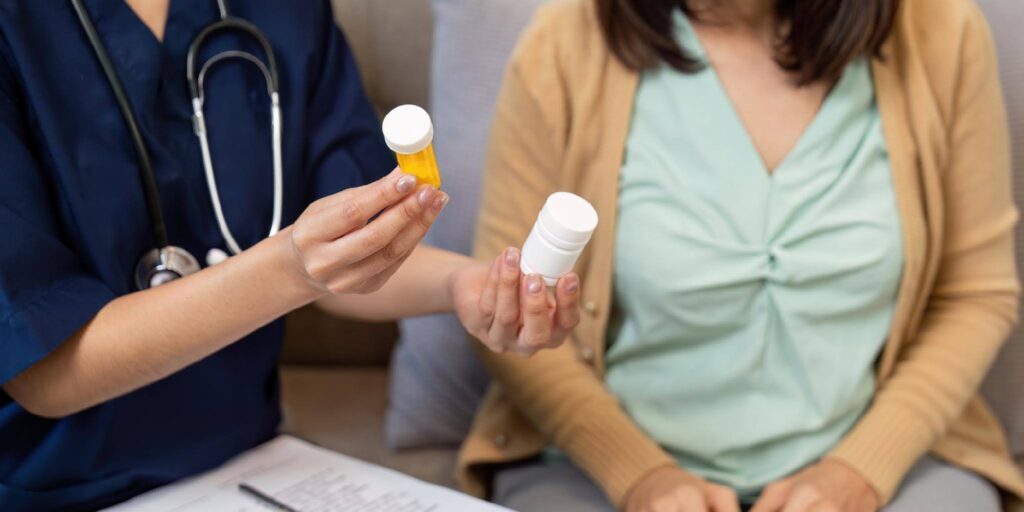 Ace Home Care caregiver helping a senior organize and manage multiple medications to reduce stress and support safe medication routines at home