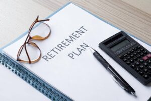 Retirement planning documents and calculator illustrating the emotional transition into retirement and how Ace Home Care supports seniors finding purpose