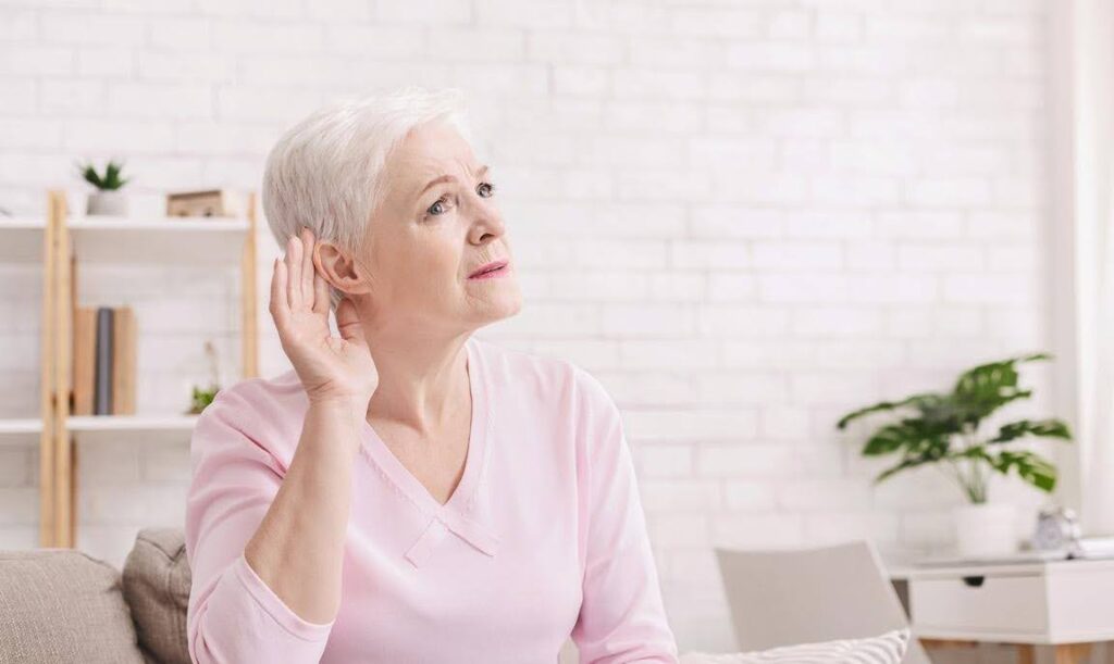 "Older adult experiencing hearing loss at home, illustrating how hearing changes family conversations and how Ace Home Care supports seniors with compassionate daily care and communication assistance.