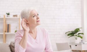 "Older adult experiencing hearing loss at home, illustrating how hearing changes family conversations and how Ace Home Care supports seniors with compassionate daily care and communication assistance.