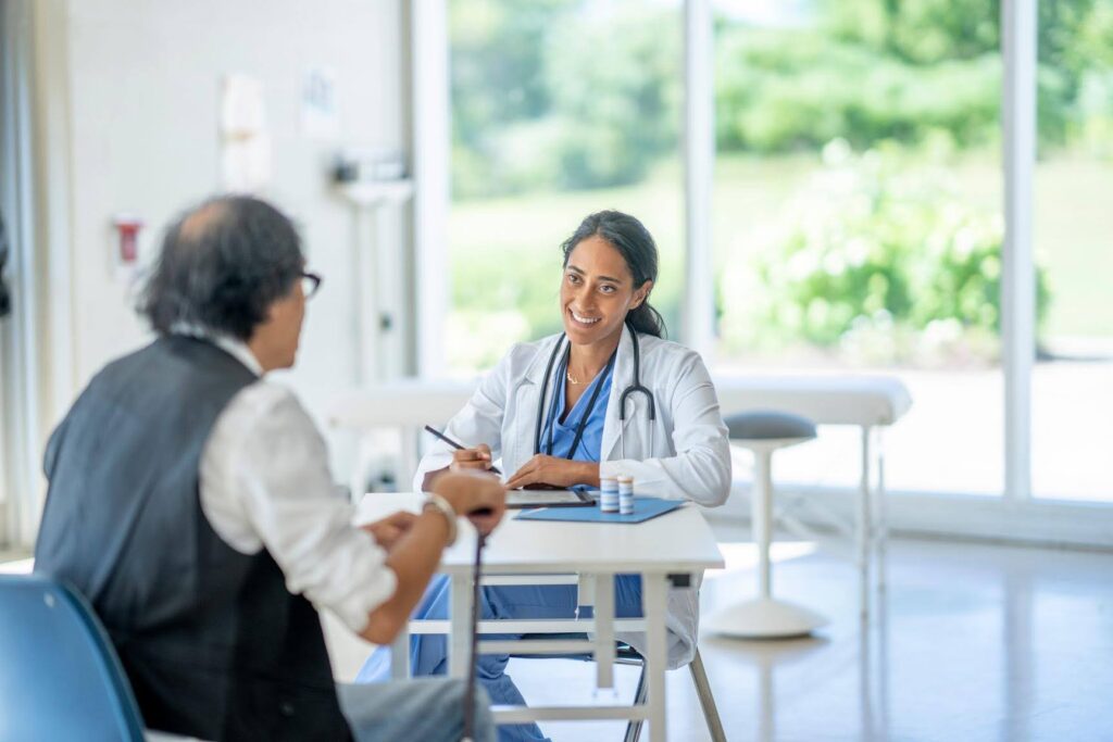 Senior meeting with a healthcare professional for medical Appointments, supported by Ace Home Care coordination services