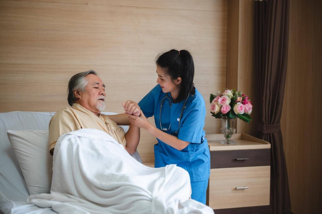 Caregiver assisting a senior during recovery after Hospitalization, highlighting the compassionate in-home support provided by Ace Home Care