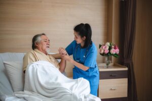 Caregiver assisting a senior during recovery after Hospitalization, highlighting the compassionate in-home support provided by Ace Home Care