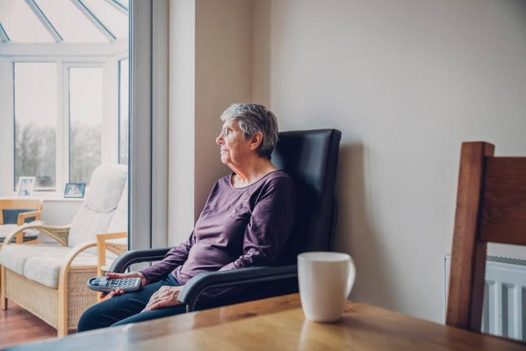 Older adult living independently at home while experiencing physical changes that may affect mobility, safety, and daily routines, with support available from Ace Home Care.