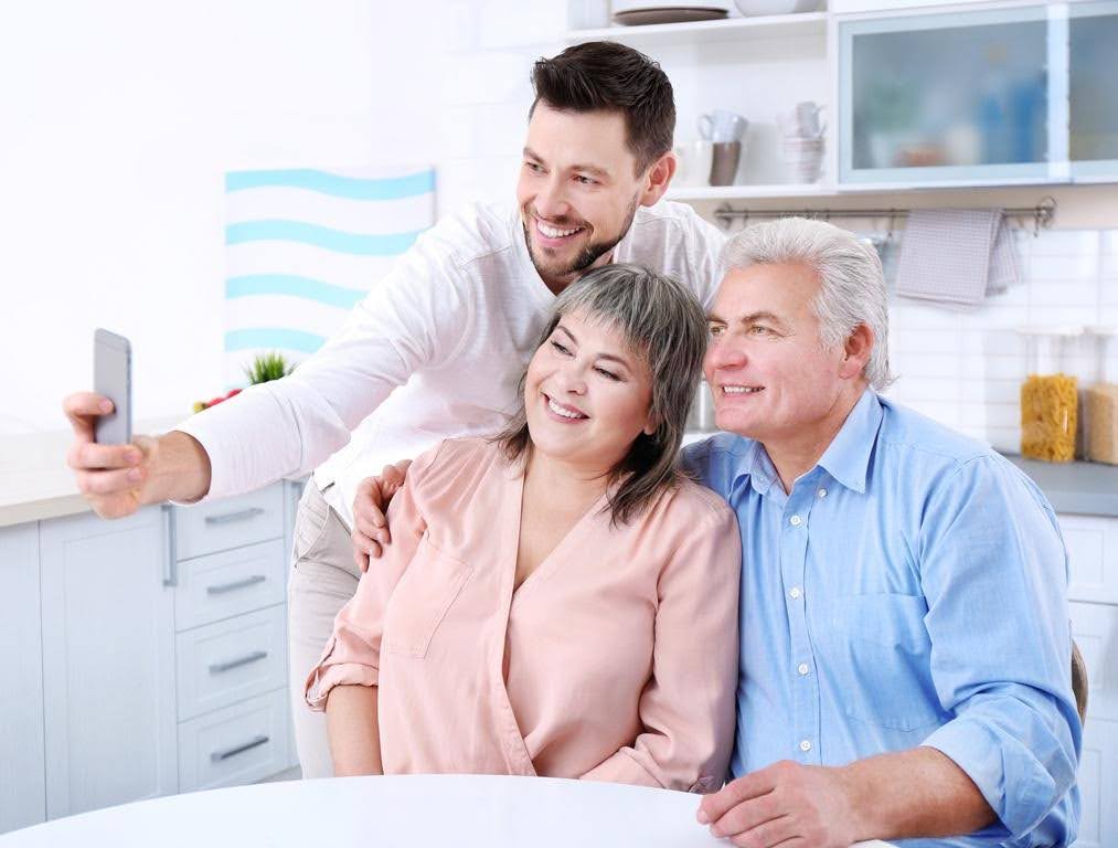 Family discussing home care options for an aging parent with support from Ace Home Care