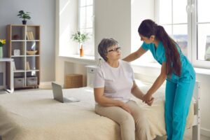 Caregiver providing home care support to an older parent while helping her stay comfortable and independent at home.