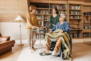 Family supporting an aging parent with mobility needs at home with help from Ace Home Care.
